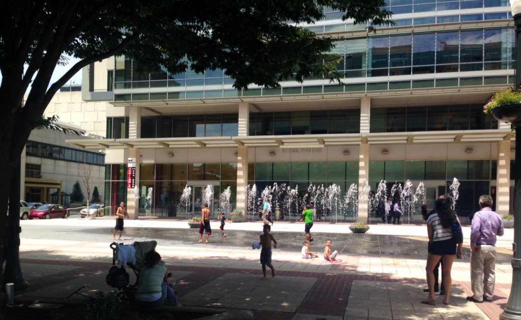 At least a dozen kids playing in the PPL plaza spray park. 