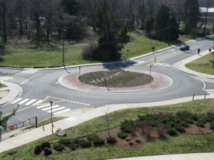 Small low speed single lane roundabout in a suburban setting. 